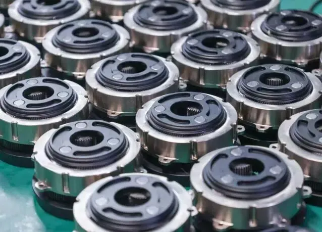 A close-up view of multiple metallic cylindrical mechanical components, possibly clutches or couplings, arranged closely together.