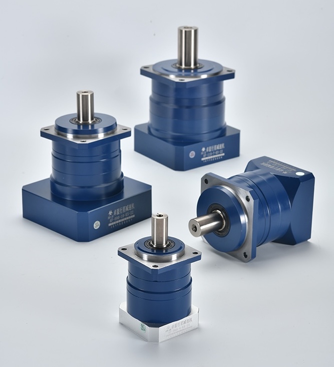 Four blue and silver planetary gearboxes, including right-angle and inline models, are arranged on a white surface.