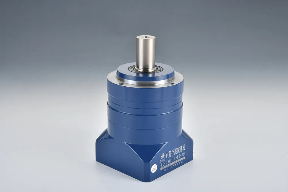 A blue planetary gear reducer with a silver output shaft stands upright against a gray background. The label reads and "AL-090-10-K5-19".