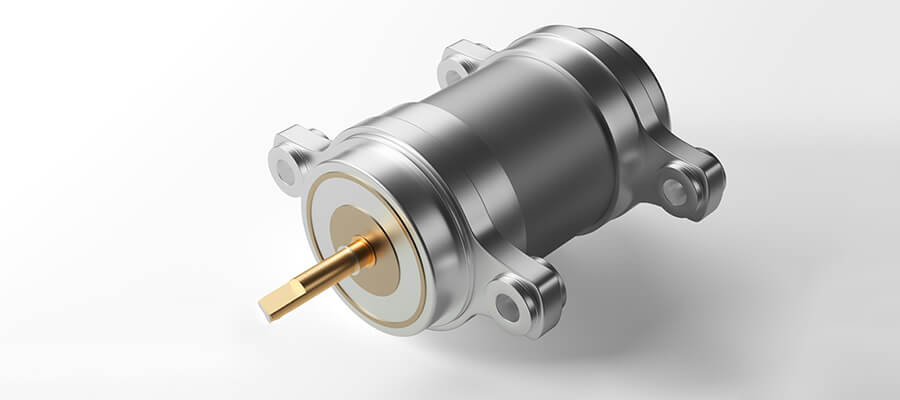 Close-up of a silver, cylindrical mechanical component with mounting lugs and a protruding gold-colored, square-tipped shaft.