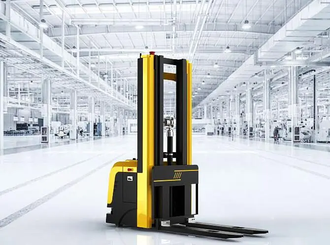 Yellow and black automated forklift standing in a bright, modern industrial facility.