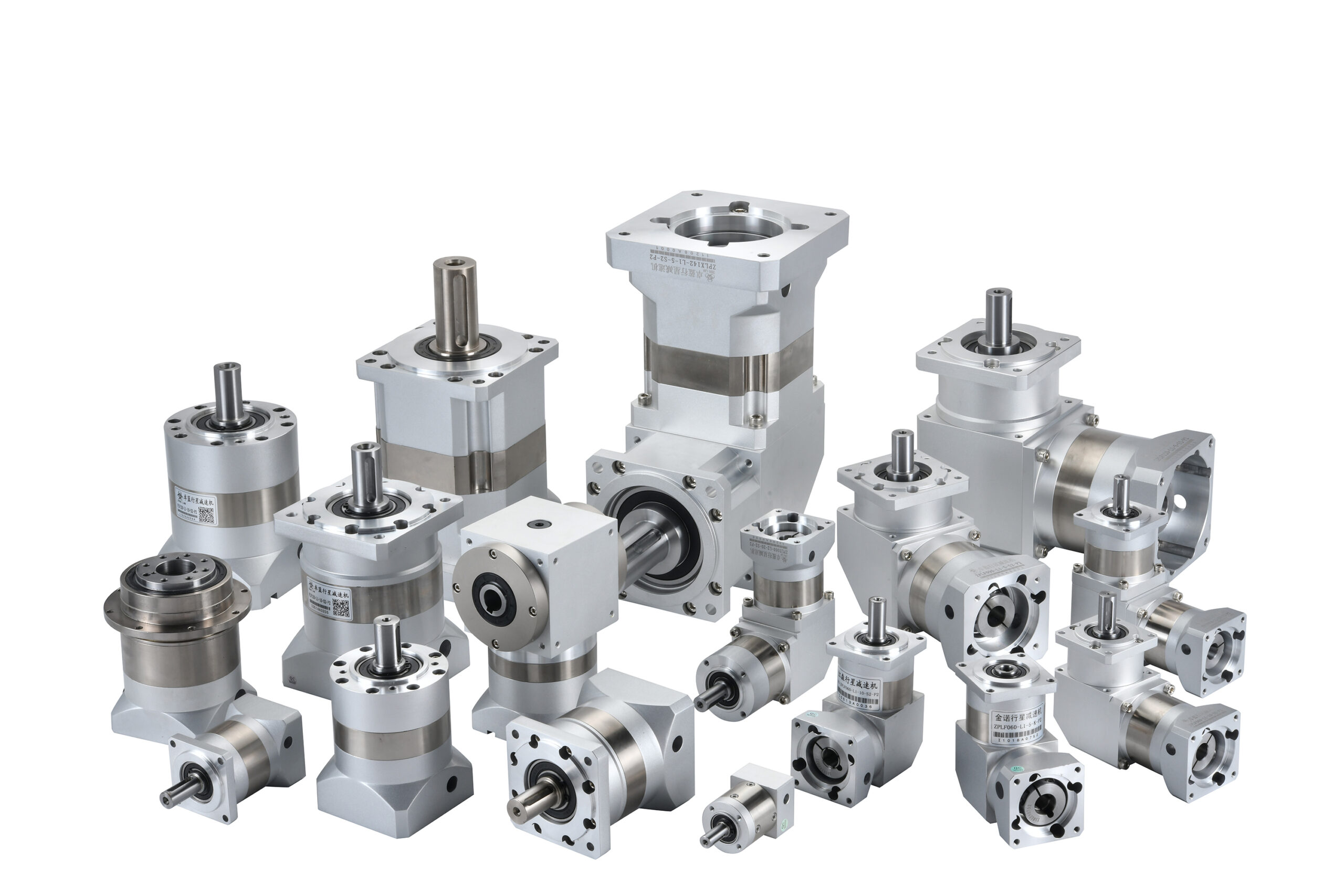 A collection of various silver industrial gearboxes and planetary reducers, featuring different sizes, shapes, and shaft configurations, displayed on a white background.