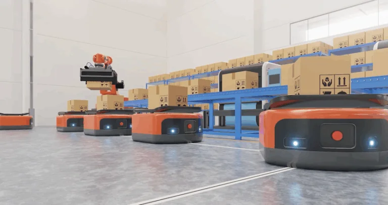 An automated warehouse scene with multiple orange and black autonomous mobile robots (AMRs) on a concrete floor. One AMR has a robotic arm stacking boxes, while others are positioned near blue conveyor belts filled with cardboard boxes.