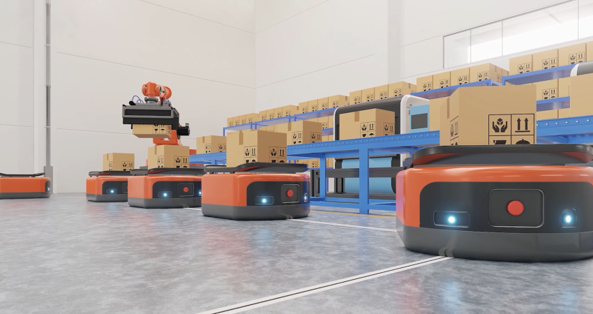 An automated warehouse scene with multiple orange and black autonomous mobile robots (AMRs) on a concrete floor. One AMR has a robotic arm stacking boxes, while others are positioned near blue conveyor belts filled with cardboard boxes.